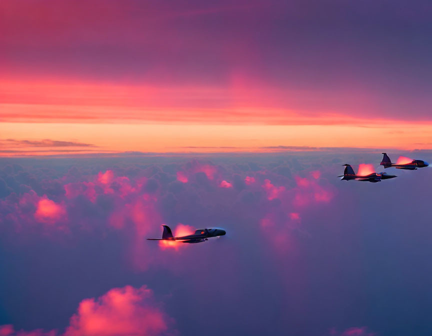 Twin jets flying in formation at sunset with pink and orange sky.