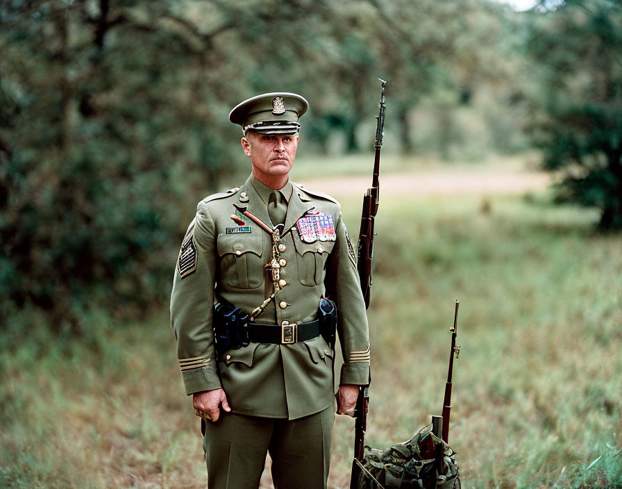 Military officer in green dress uniform with rifle in wooded area