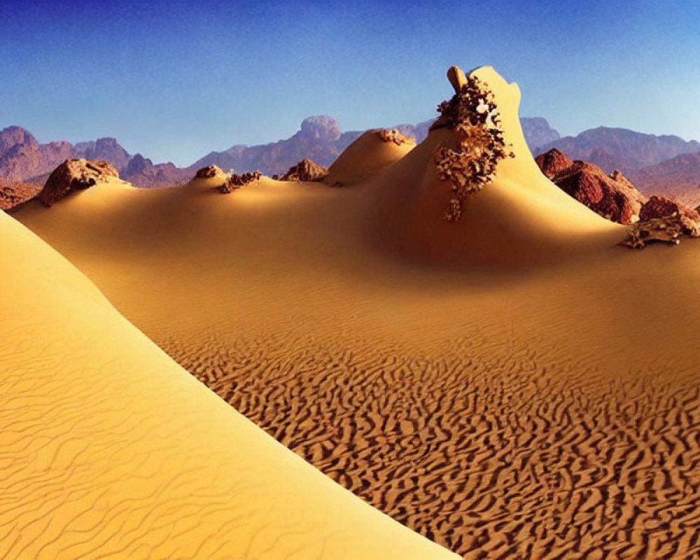 Tranquil desert landscape with dunes, blue sky, and mountains