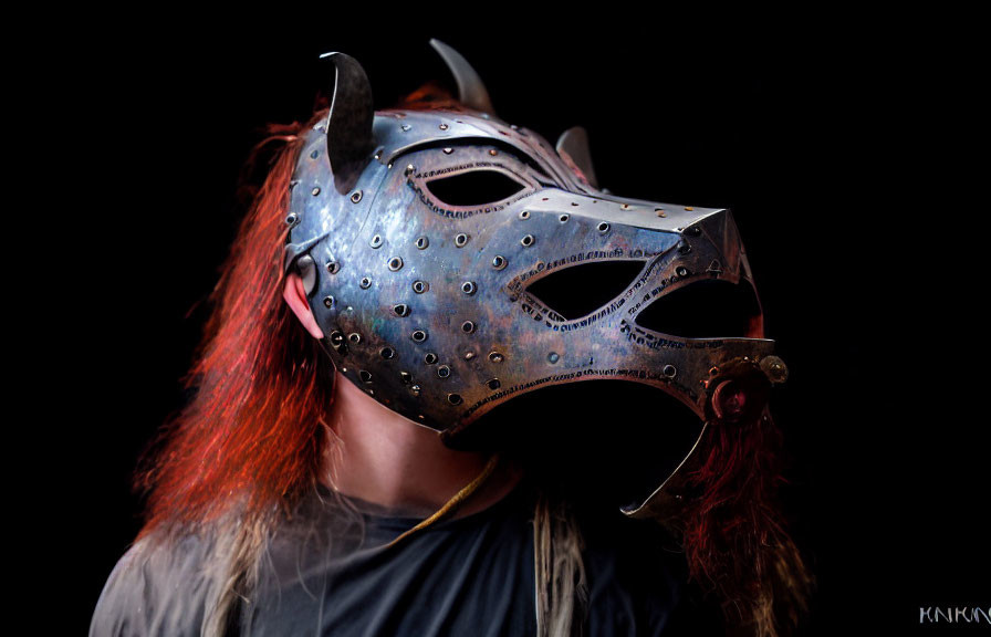 Metallic Spiked Mask with Red Hair on Black Background