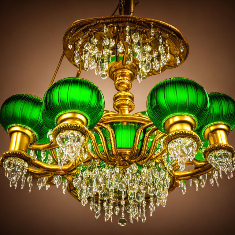 Elegant chandelier with green glass shades and crystal pendants