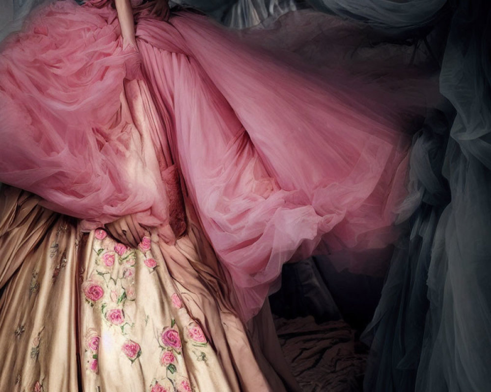 Elegant Pink Gown with Tulle Overlay and Floral Skirt in Romantic Setting