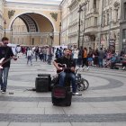 Musicians and Pedestrians in a Sunlit Town Square