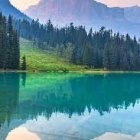 Serene Lake with Mountain Reflections and Twilight Cabin