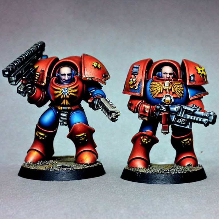 Detailed Warhammer 40k Space Marine Figurines in Blue and Red Armor