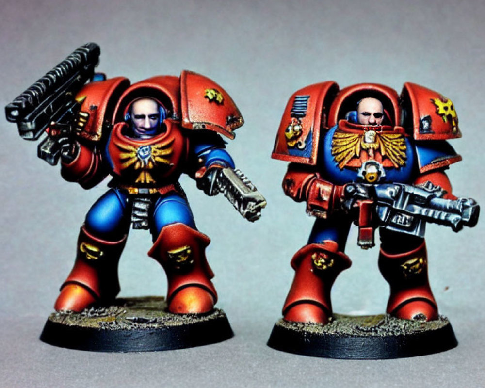 Detailed Warhammer 40k Space Marine Figurines in Blue and Red Armor