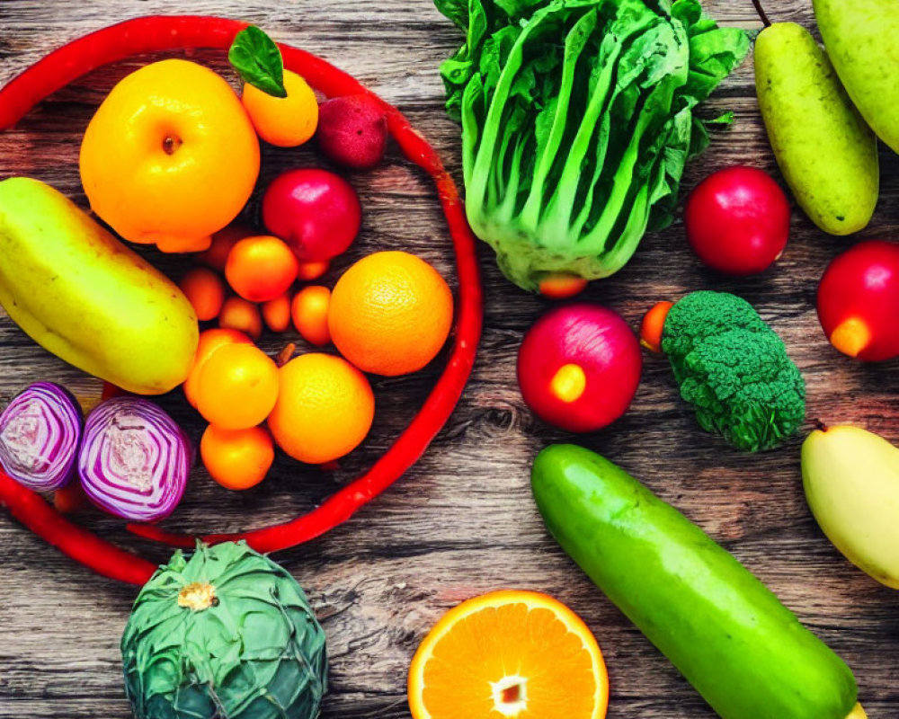 Vibrant fruits and vegetables on wooden table: citrus, squash, leafy greens