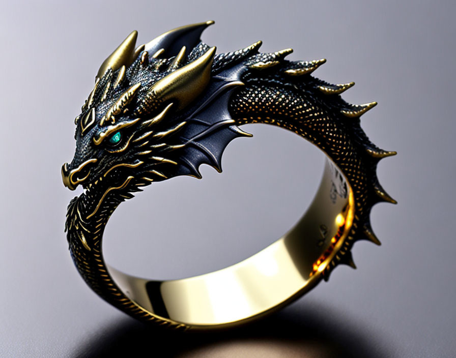 Dragon-shaped Ring with Black and Gold Details and Green Gemstone Eyes on Reflective Surface