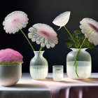 Pastel poppies in translucent vases on draped table with dark backdrop