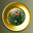 Gold-Rimmed Decorative Plate with Pink Flowers and Green Leaves on Green Background