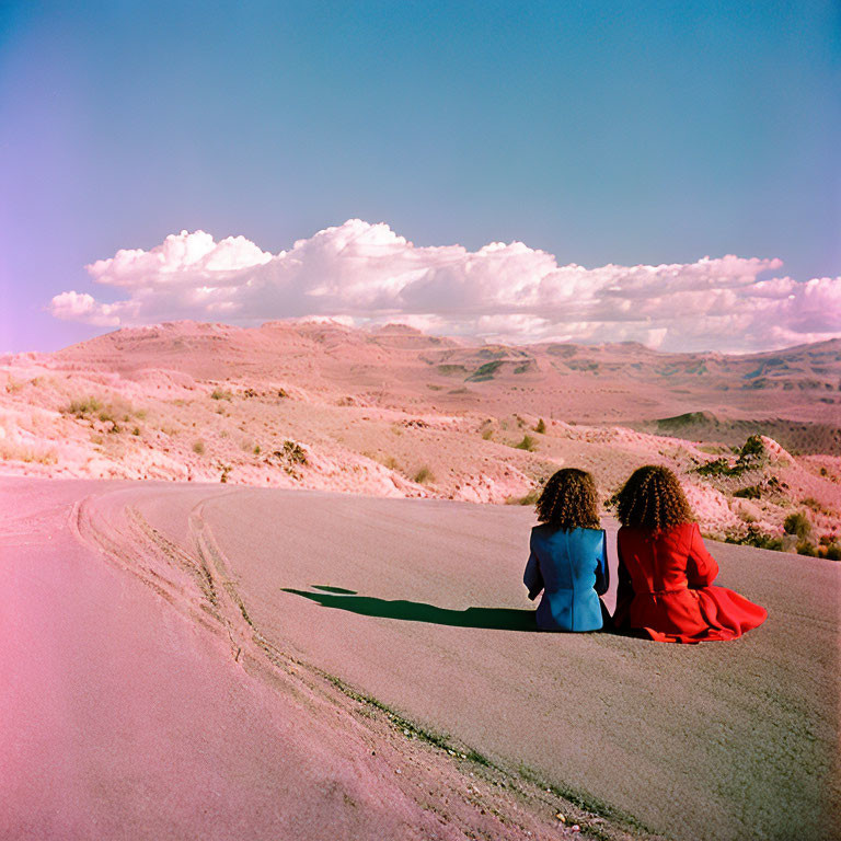 Curly-haired duo on deserted road in scenic landscape