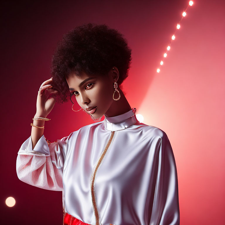 Stylish woman with afro in white blouse and red skirt against pink background