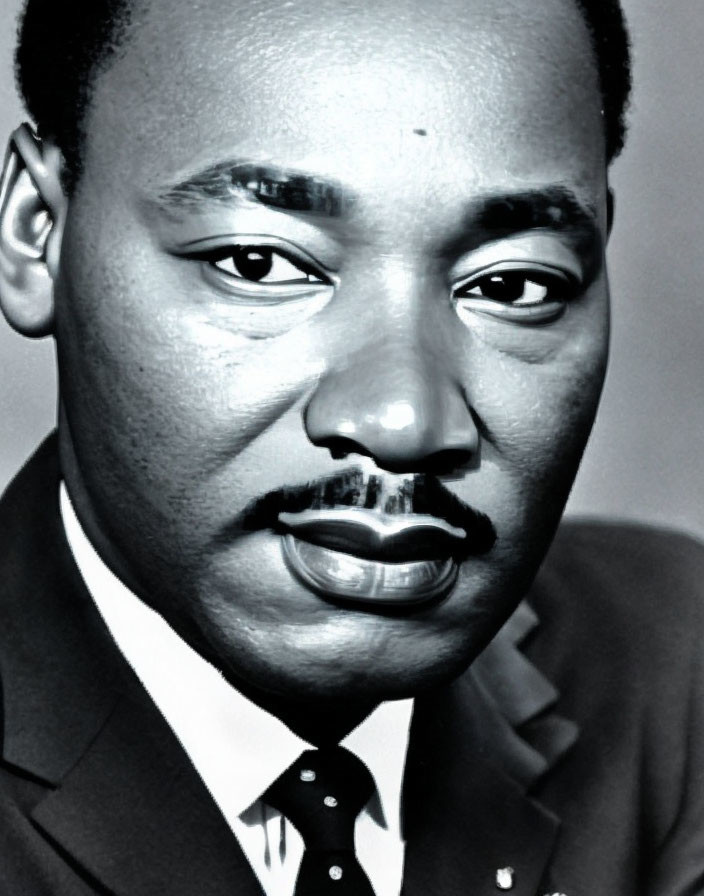 Portrait of African-American man with mustache in suit and tie