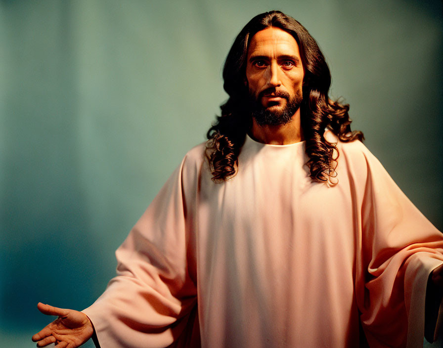 Man Figurine with Long Brown Hair and White Robe on Blue Background