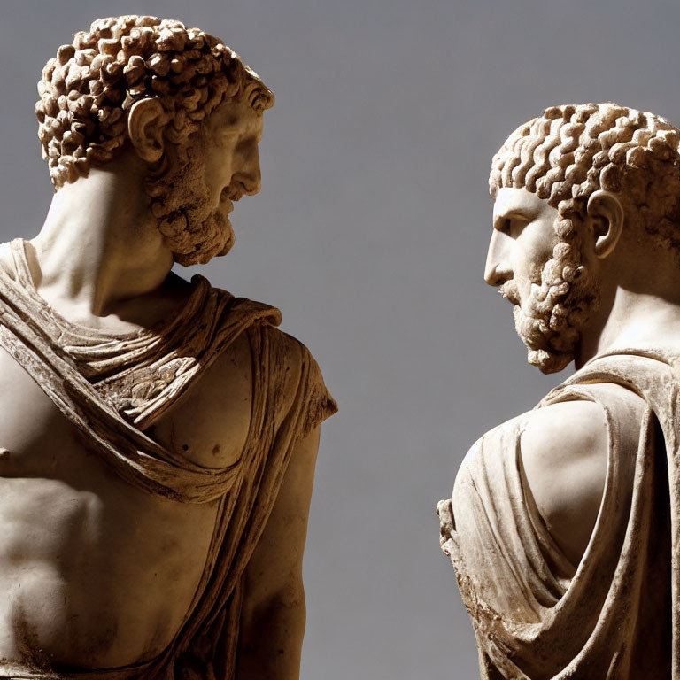 Ancient Greek statues: left and right profile, classical features, draped clothing