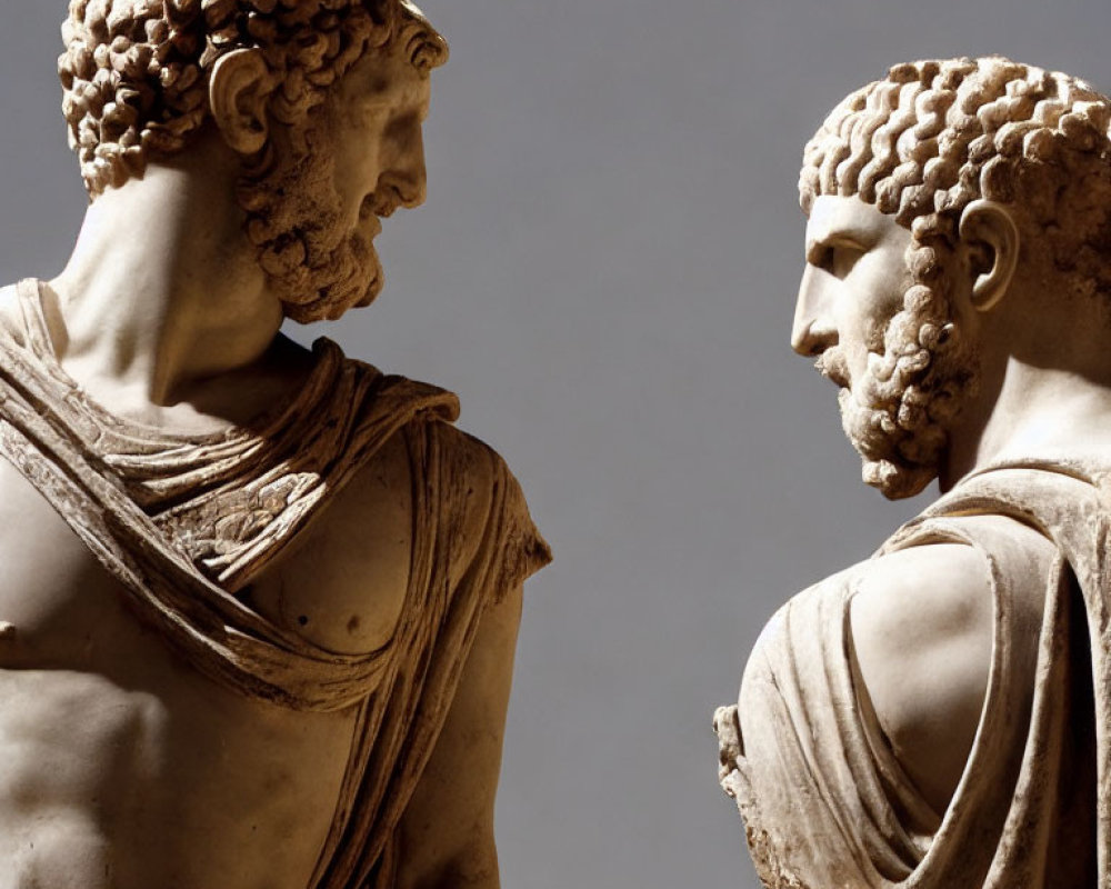 Ancient Greek statues: left and right profile, classical features, draped clothing