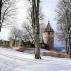 Surreal Winter Landscape with Pod-Shaped Structure and Floating Orbs