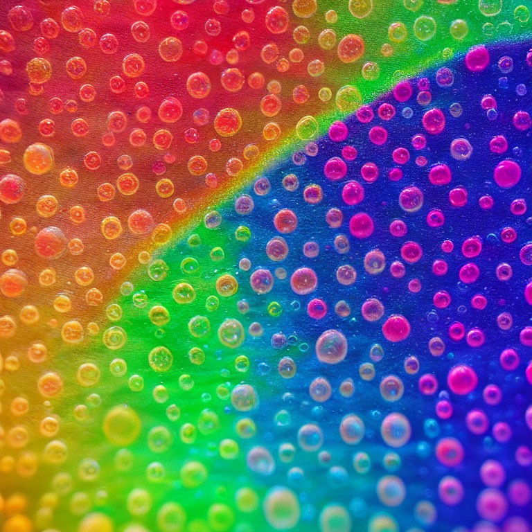 Colorful Spectrum of Vibrant Water Droplets on a Surface