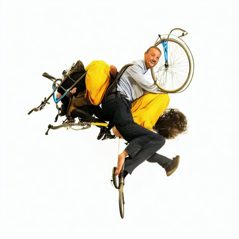 Two people in comical pose on tilted bicycle against white background