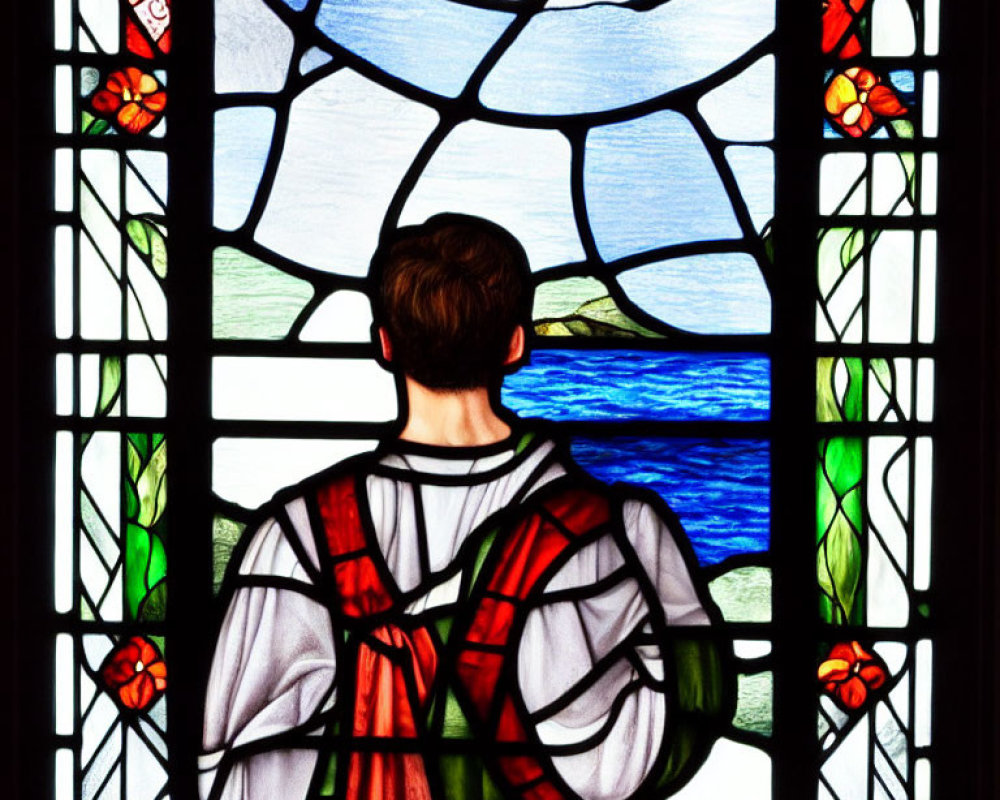 Person in robe gazes at vibrant stained glass window with scenic view.