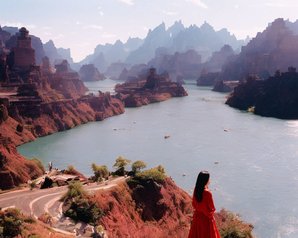 Person in Red Dress Observing River and Rock Formations