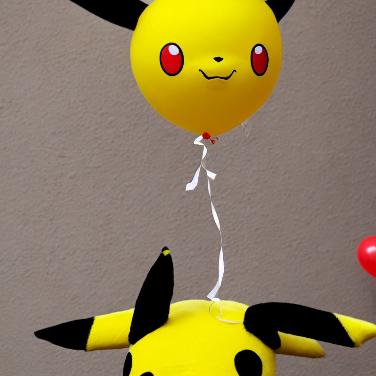 Yellow Pikachu-shaped Balloon Floats Above Pikachu Plush Toy