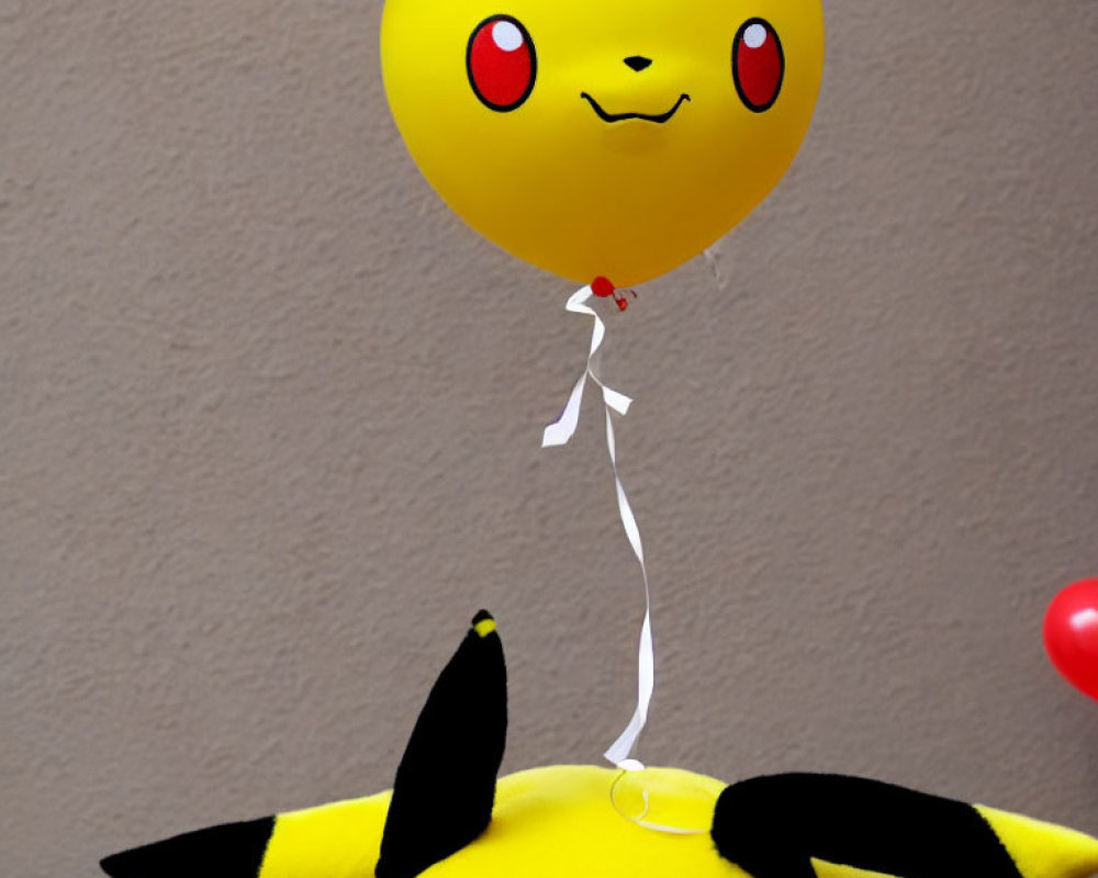 Yellow Pikachu-shaped Balloon Floats Above Pikachu Plush Toy