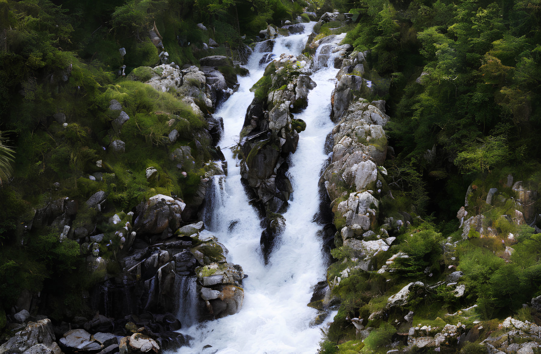 Scenic waterfall in rocky terrain with lush greenery