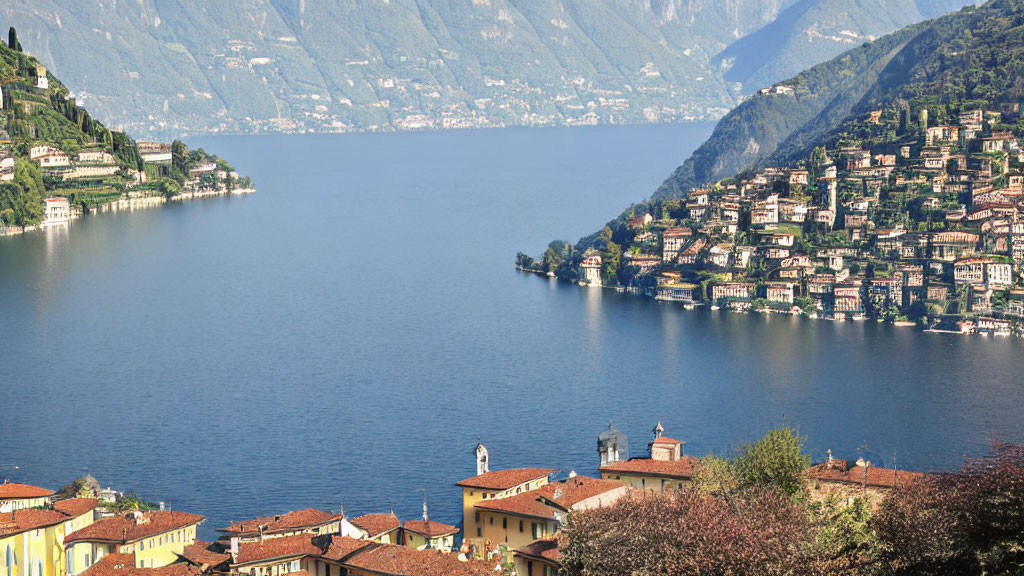 Tranquil Lake and Colorful Buildings in Lush Green Hills