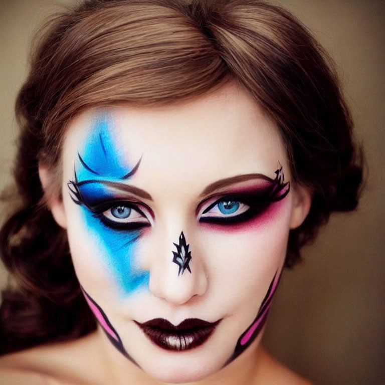 Woman with Blue and Pink Dramatic Face Paint and Spider Design