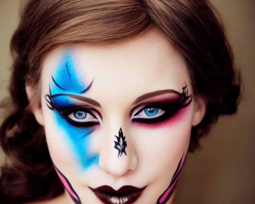 Woman with Blue and Pink Dramatic Face Paint and Spider Design