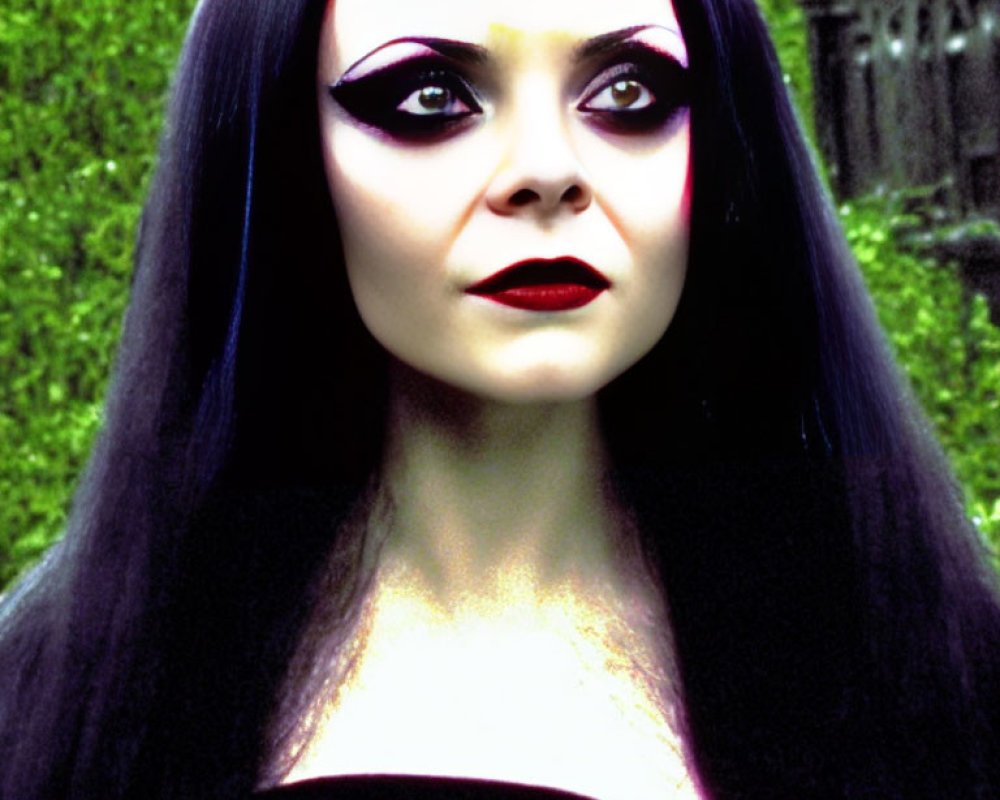 Portrait of Woman with Pale Skin, Long Black Hair, Dramatic Makeup, Greenery Backdrop