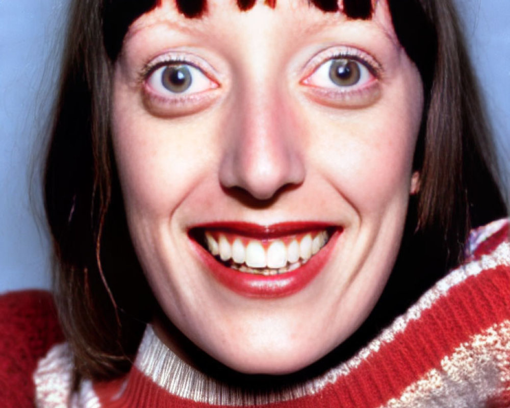 Portrait of Smiling Woman with Blue Eyes and Red Lipstick