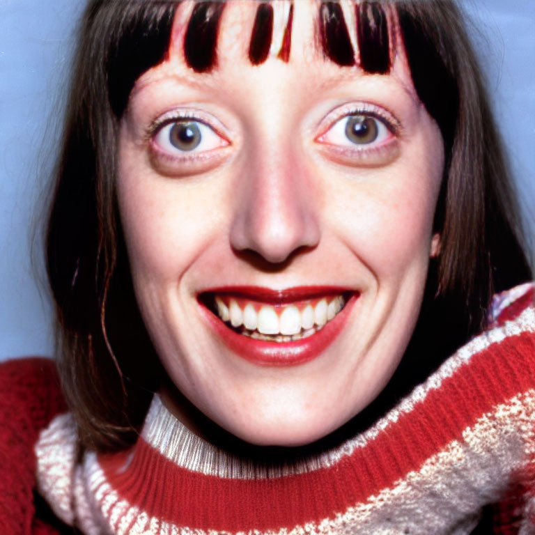 Portrait of Smiling Woman with Blue Eyes and Red Lipstick