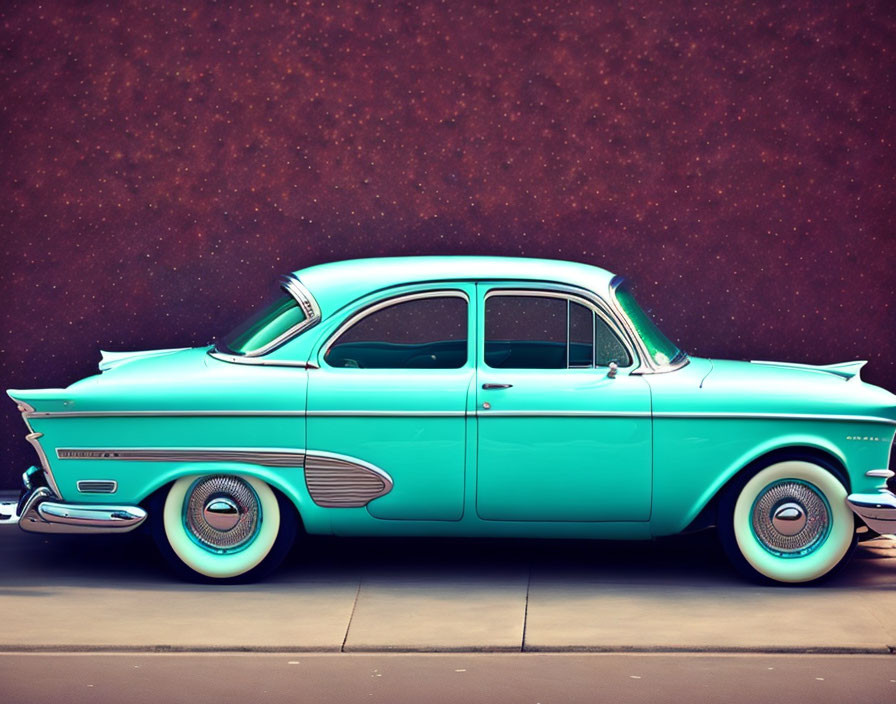 Vintage Turquoise Car with Tailfins and White Sidewall Tires