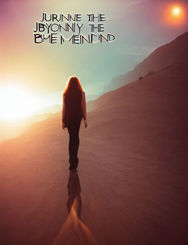 Person with long hair walking up desert sand dune at sunset