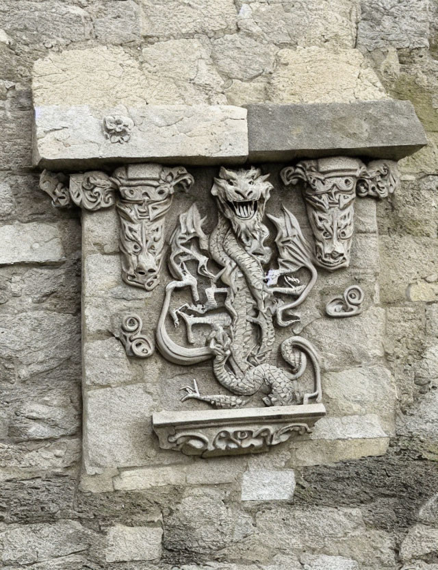 Intricate Dragon Bas-Relief Sculpture on Stone Wall