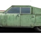 Classic Green Car with Streamlined Design and Chrome Accents