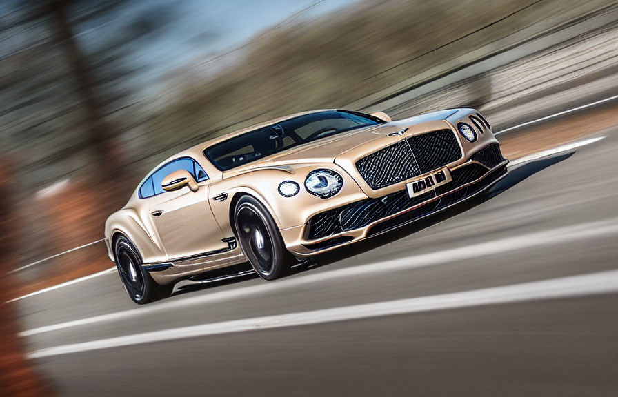 Luxurious Gold Bentley Continental GT Speeding on Blurred Road