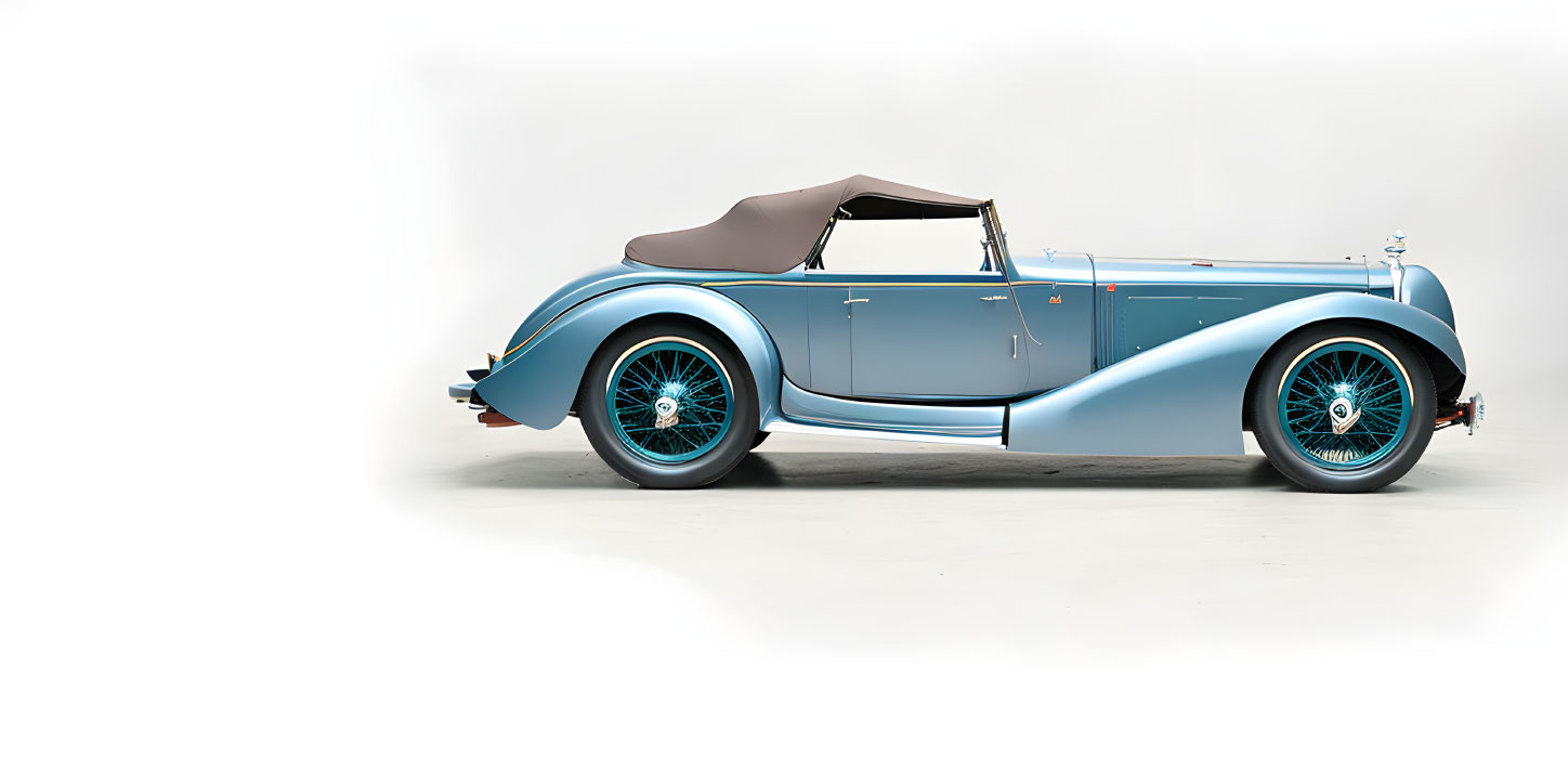 Vintage Light Blue Convertible Car with Soft-Top Roof and White-Wall Tires