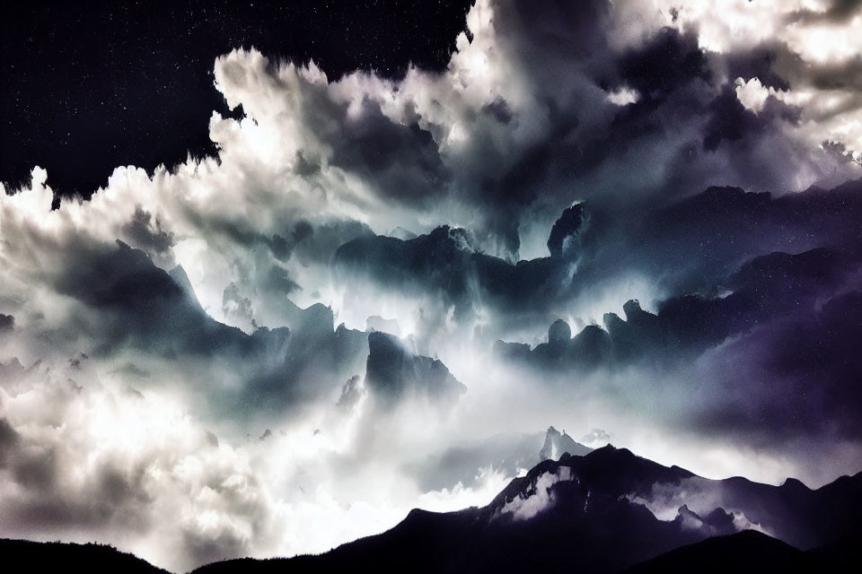 Dark Textured Clouds Over Silhouetted Mountain Peaks