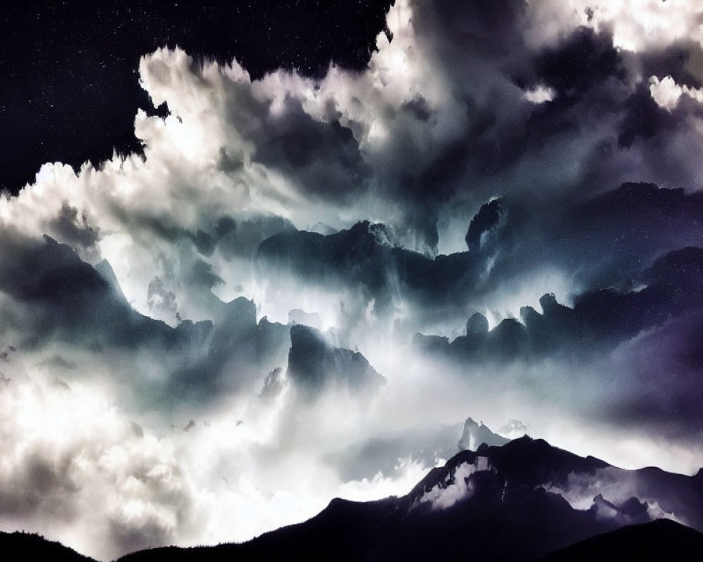 Dark Textured Clouds Over Silhouetted Mountain Peaks