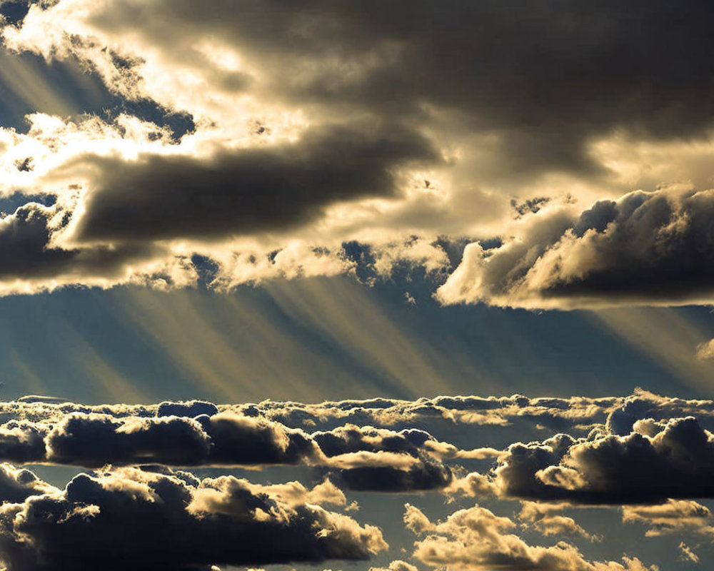 Dramatic sunrays through dark clouds create striking light pattern