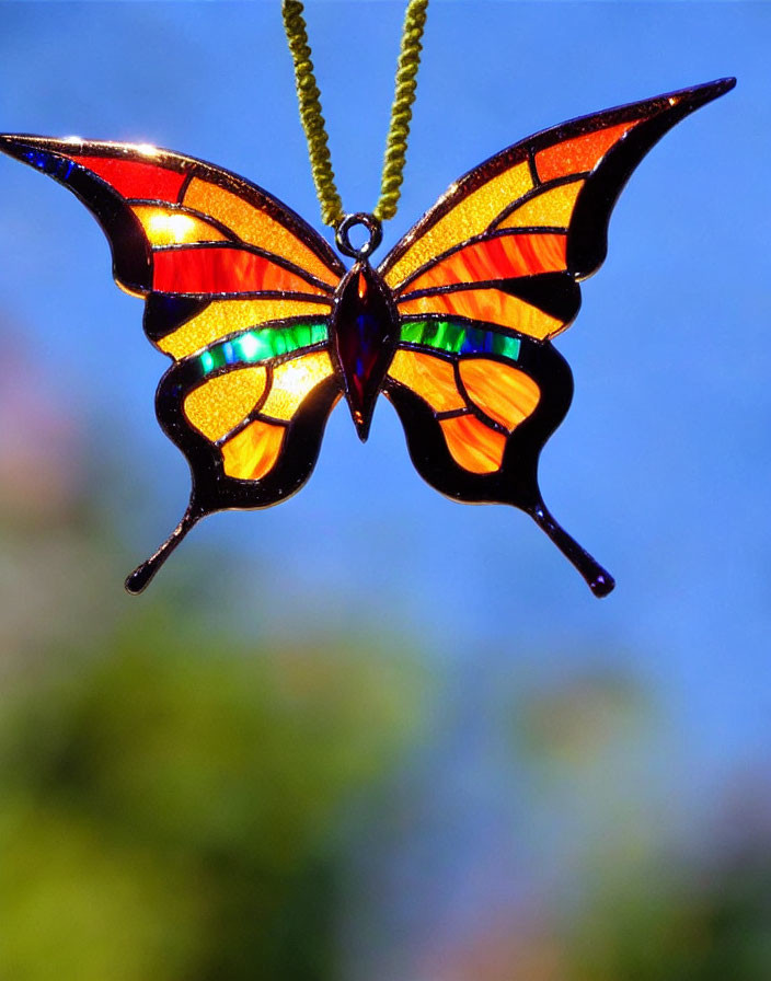 Colorful Stained Glass Butterfly Pendant with Red, Orange, Yellow, and Blue Hues