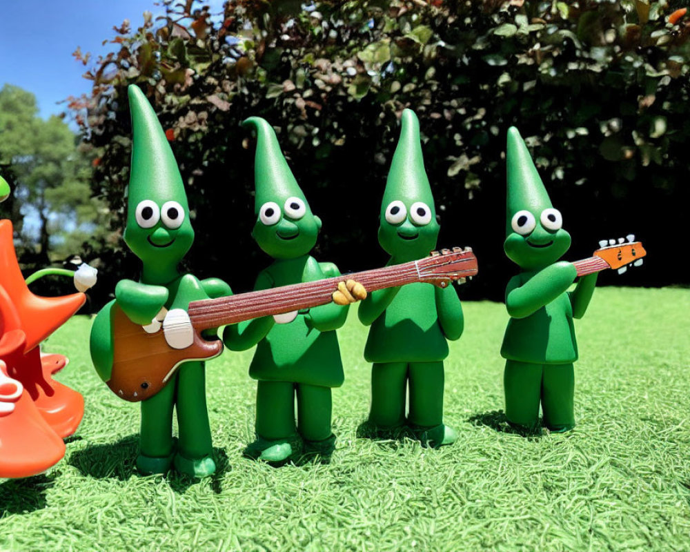 Four Elf-like Toy Figures Playing on Grass with Guitar