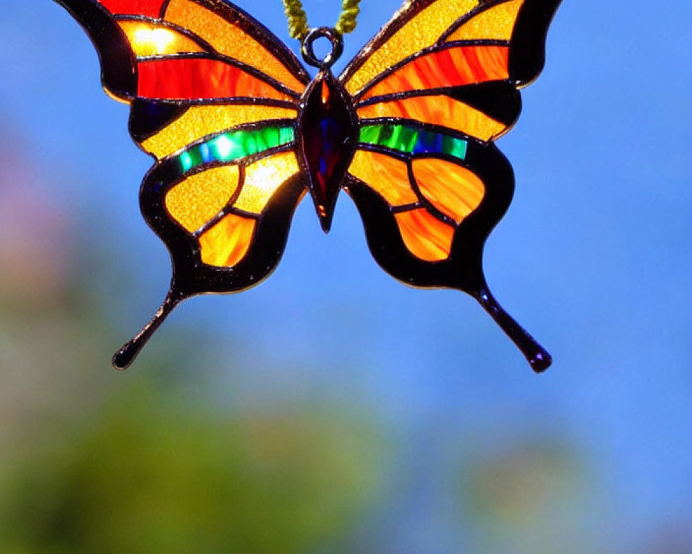 Colorful Stained Glass Butterfly Pendant with Red, Orange, Yellow, and Blue Hues