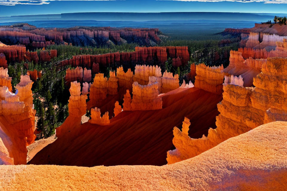 Majestic hoodoos and lush forest under clear blue sky