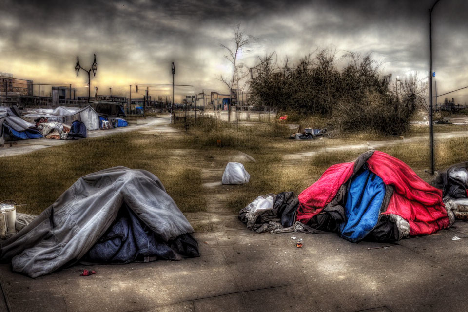 Urban scene with makeshift shelters and litter under overcast sky