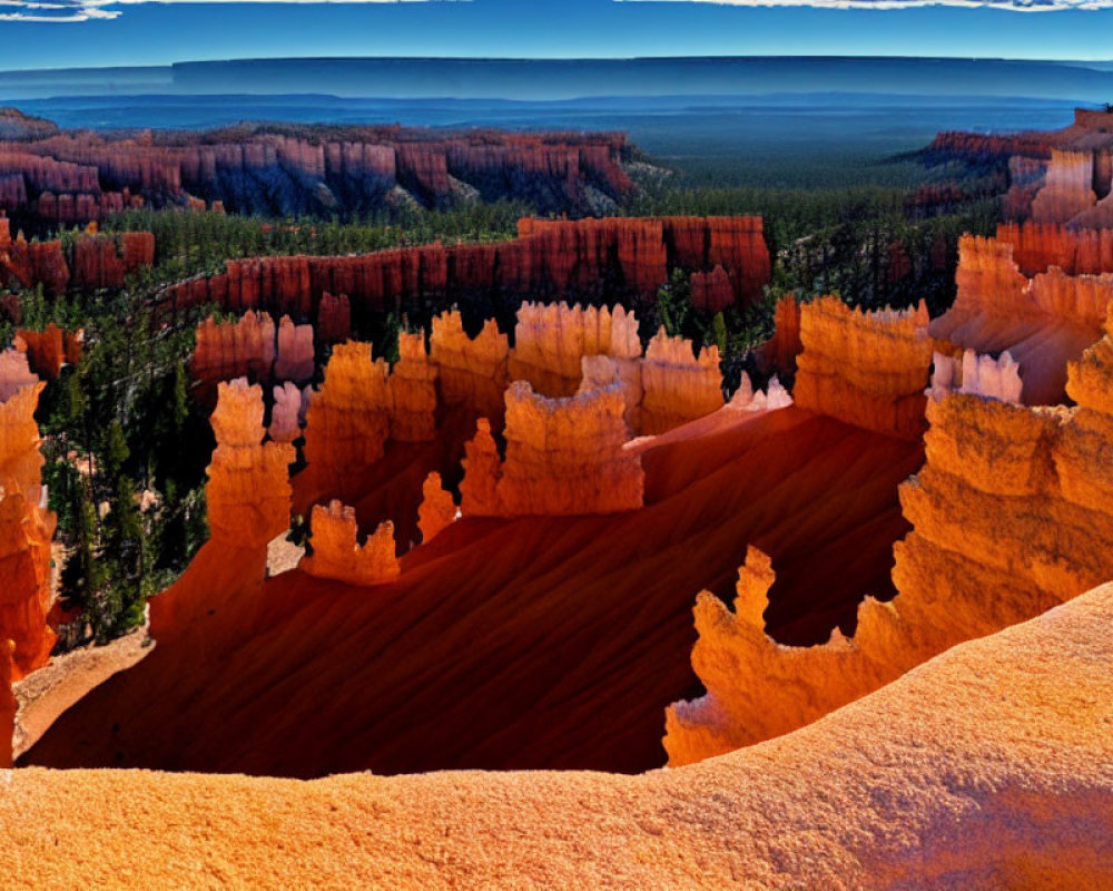 Majestic hoodoos and lush forest under clear blue sky