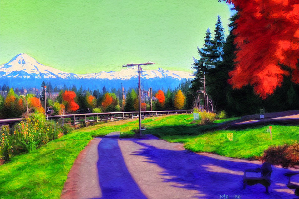 Scenic park with autumn trees, pathway, benches, and distant snow-capped mountain